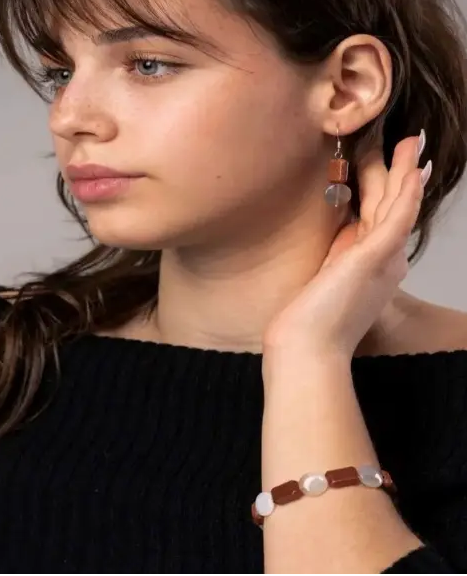 Model is wearing the Brown Goldstone and Agate Bracelet set.