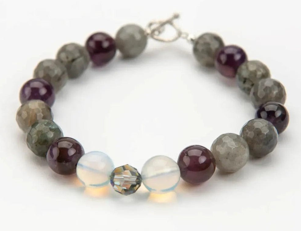 Beaded bracelet with multicolored beads on a white background