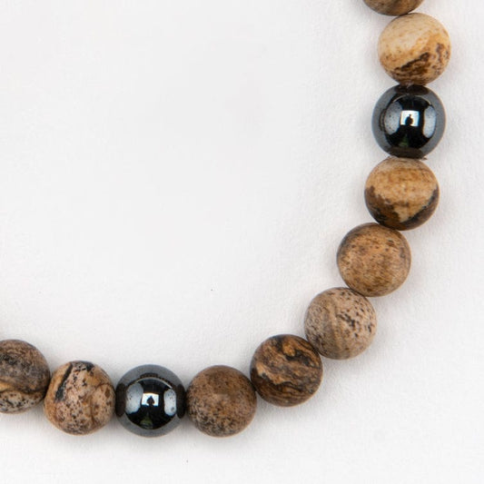 Half Jasper Hematite Bracelet beads on a white background.