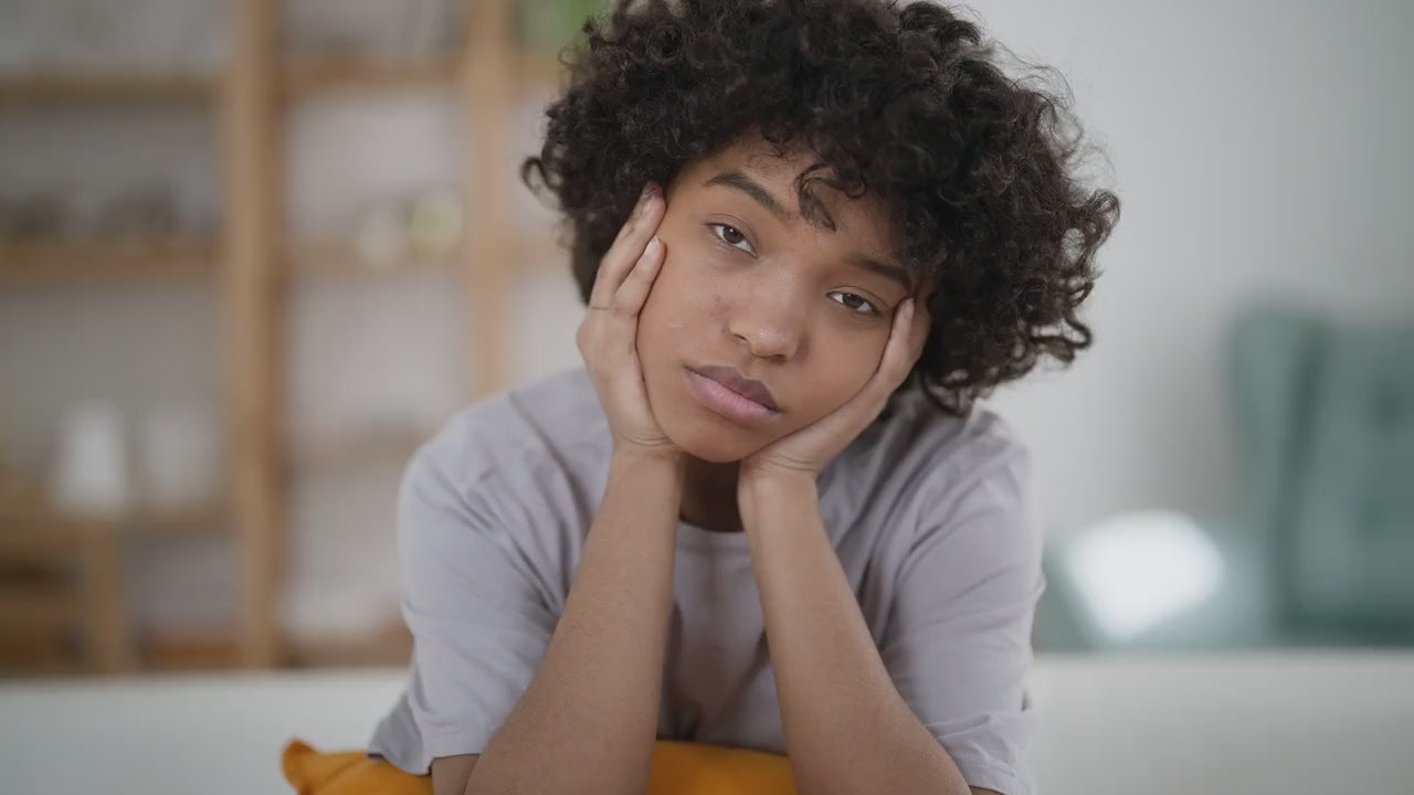 Load video: Girl sitting with her hands on her face looking sad. This video is about what it means to Feel Good on Purpose.