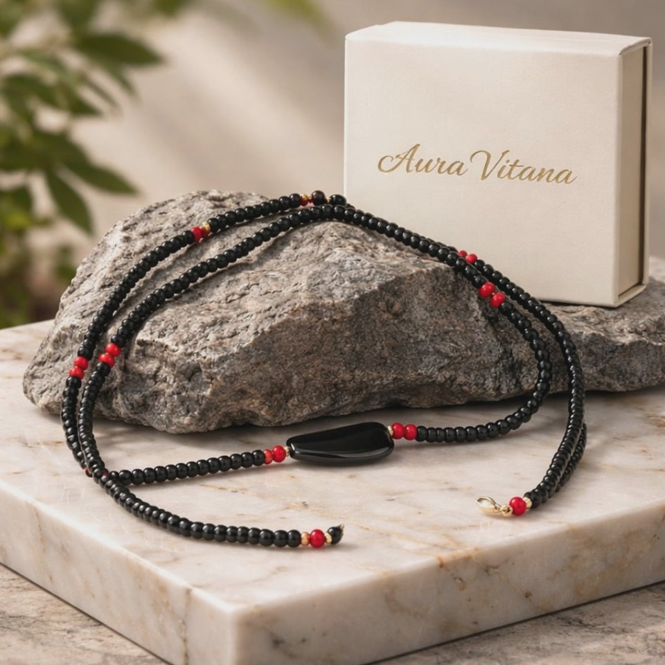 Video showing a close up of the Men's Minimal Necklace sitting on a rock and a white marbled table.