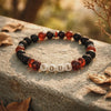 Bracelet on a wall with the word 'Soul' in gold.